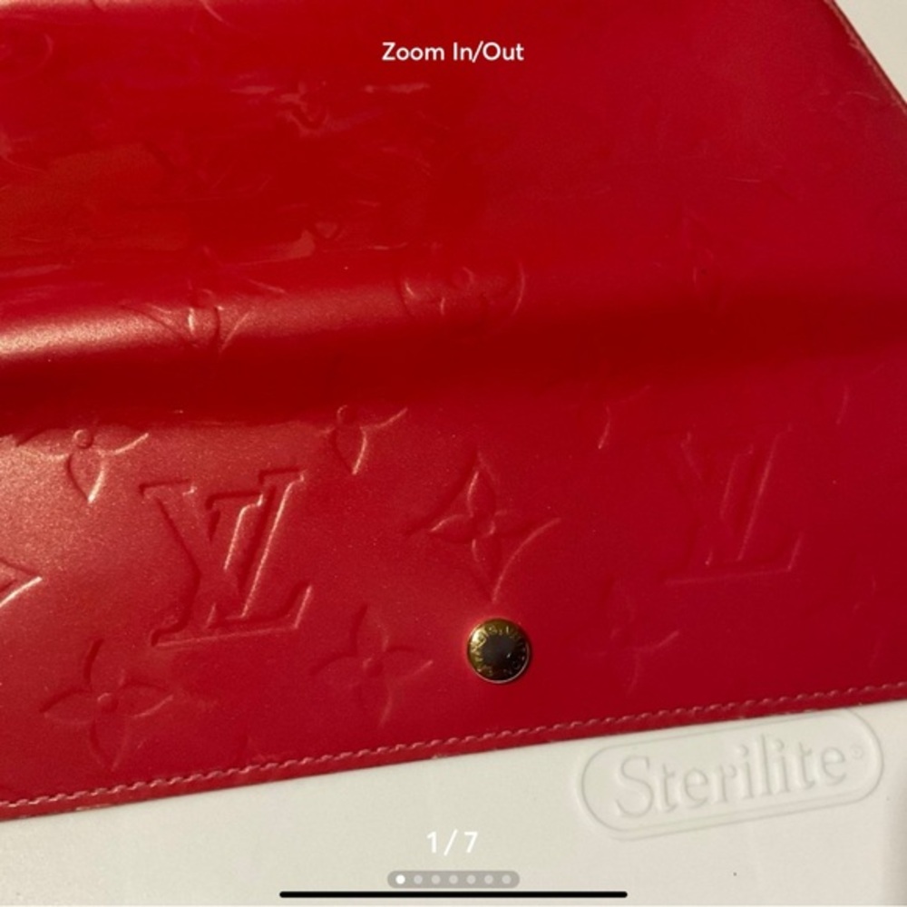 Louis Vuitton Monogram Vernis Sarah Long Wallet in pink with some coin residue.